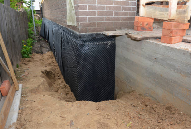SJ Waterproofing Pros technician performing targeted Sump Pump Installation assessment in Free Soil, MI